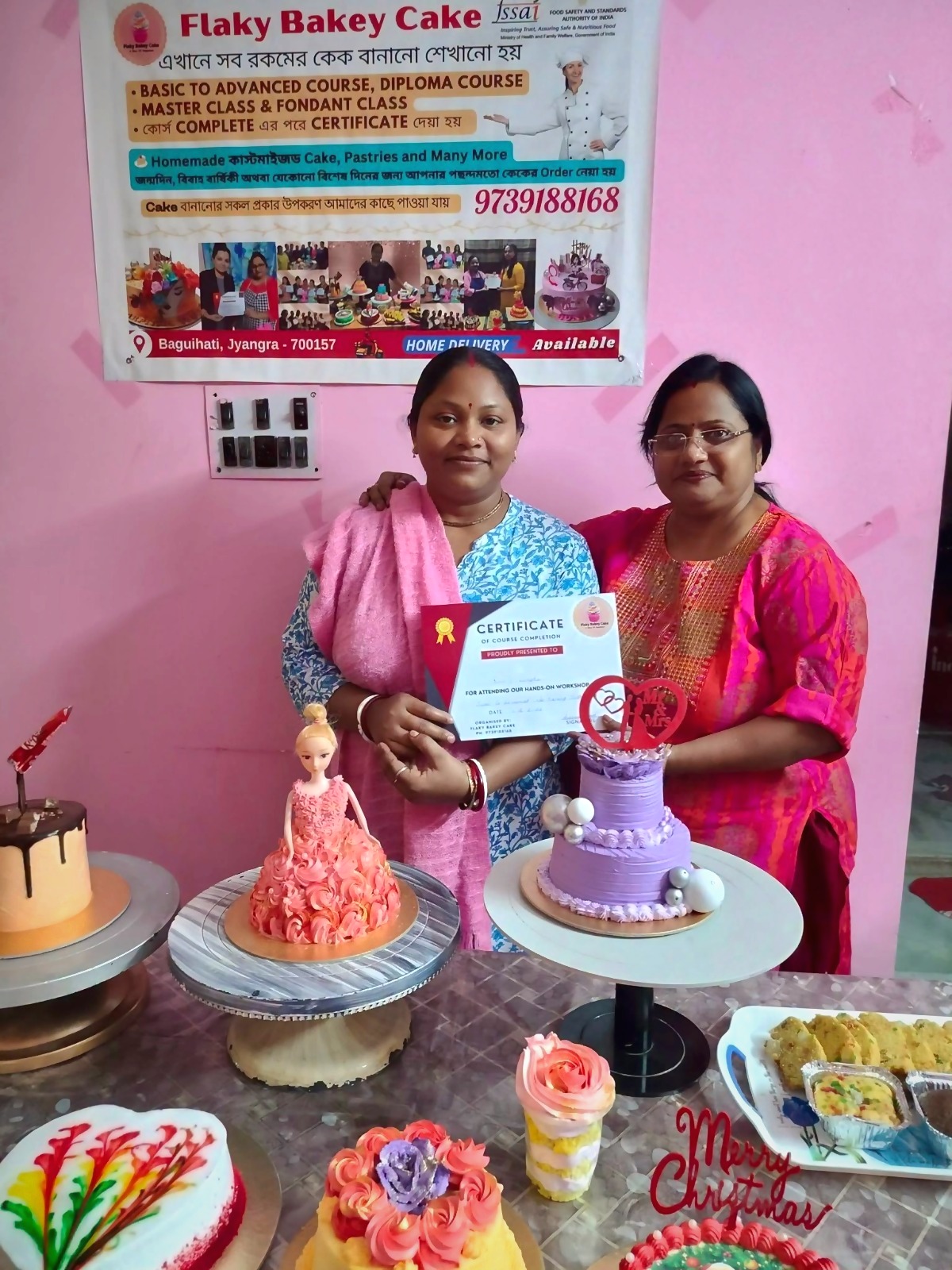 Ashima Ghosh presenting a diploma certificate to a Flaky Bakey cake class graduate