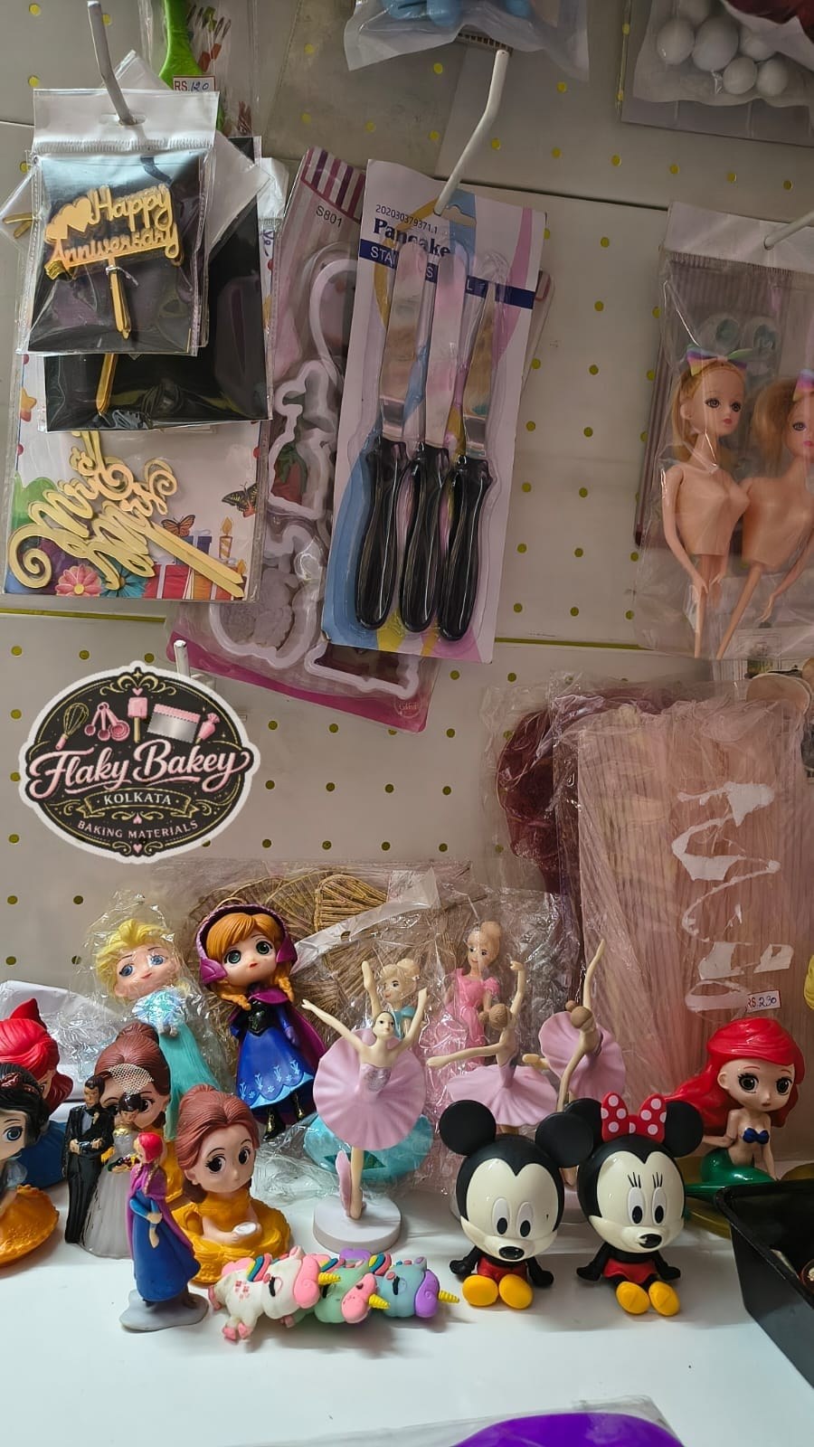 Cake toppers and cutters shelf inside the Flaky Bakey baking materials store, Hatiara Kolkata